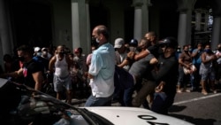 Police detain an anti-government demonstrator during a protest in Havana, Cuba, Sunday July 11, 2021. (AP Photo/Ramon Espinosa)