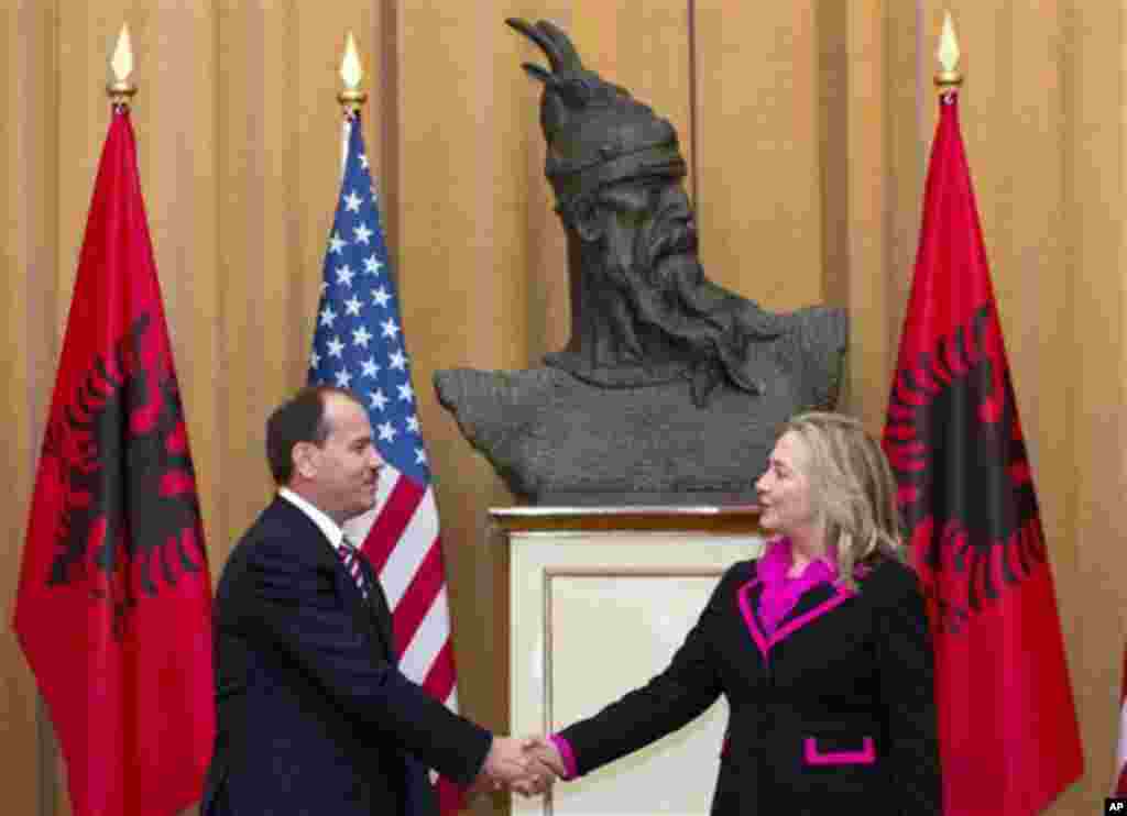 Albanian President Bujar Nishani and US Secretary of State Hillary Clinton shake hands following meetings at the Palace of the Brigades in Tirana, Albania, Thursday, Nov. 1, 2012. Hillary Clinton arrived in EU-hopeful Albania on the last leg of her Balkan