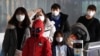 FILE - Passengers wearing masks to prevent a new coronavirus arrive at Incheon International Airport in Incheon, South Korea, Jan. 29, 2020. 