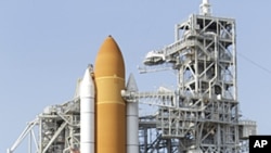 The crew of space shuttle Atlantis, from left: mission specialist Rex Walhiem, mission specialist Sandy Magnus, pilot Doug Hurley and commander Chris Ferguson attend a news conference at Pad 39A during the Terminal Countdown Demonstration Test at the Kenn