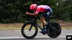 Neilson Powless of the US competes during Stage 20 of the Tour de France cycling race, an individual time trial over 36.2 kilometers, from Lure to La Planche des Belles Filles, France, Sept. 19, 2020. 