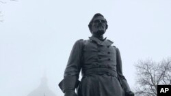 A statue of Civil War hero Hans Christian Heg is seen on March 11, 2020, outside the Wisconsin state Capitol, in Madison, Wis. The Wisconsin abolitionist's descendants are imploring state officials to repair and reinstall the statue. 