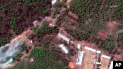 FILE - This May 23, 2018, satellite image provided by DigitalGlobe shows the Punggye-ri test site in North Korea.
