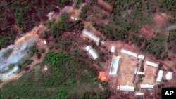 FILE - This Wednesday, May 23, 2018 satellite file image provided by DigitalGlobe, shows the Punggye-ri test site in North Korea.