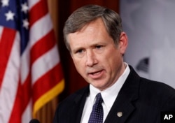 FILE - Sen. Mark Kirk, R-Ill., talks to the media on Capitol Hill in Washington.