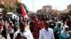 Sudanese domonstrators take part in a rally to protest against last year's military coup, in the capital Khartoum, on Jan. 30, 2022.