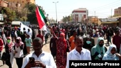 Sudanese domonstrators take part in a rally to protest against last year's military coup, in the capital Khartoum, on Jan. 30, 2022.