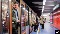 Commuters arrive at Maelbeek metro station in Brussels, Belgium, April 25, 2016.