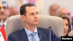 FILE - Syrian President Bashar Assad attends the Arab League summit in Jeddah, Saudi Arabia, May 19, 2023. Assad is wanted on an international arrest warrant, accused of complicity in war crimes. (Saudi Press Agency via Reuters)