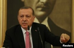 Turkish President Recep Tayyip Erdogan speaks during a news conference at Ataturk International Airport in Istanbul, Turkey, Sept. 8, 2017.