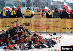 People demonstrate against the speech of Seyyed Alireza Avaei, Minister of Justice of Iran, at the Human Rights Council, in front of the United Nations in Geneva, Switzerland, Feb. 27, 2018.