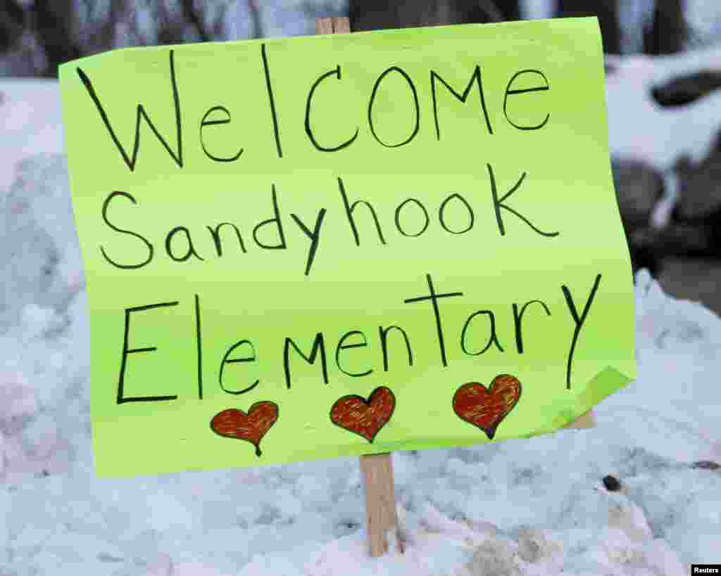 Signs of support are seen along the road between Newtown and Monroe, where the kids from Sandy Hook Elementary will begin to attend classes in Monroe, Connecticut, January 2, 2013.
