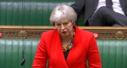 In this screengrab provided by the House of Commons, Britain's former prime minister Theresa May speaks during the debate in the House of Commons on the EU (Future Relationship) Bill in London, Dec. 30, 2020.