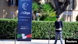 A policeman stands guard inside Villa Igiea, the venue of the international conference on Libya in Palermo, Italy, Nov. 12, 2018. 