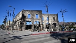 A building that once housed restaurants and coffee shops among other businesses is seen destroyed by the Palisades Fire in Pacific Palisades, California, Jan. 12, 2025. 