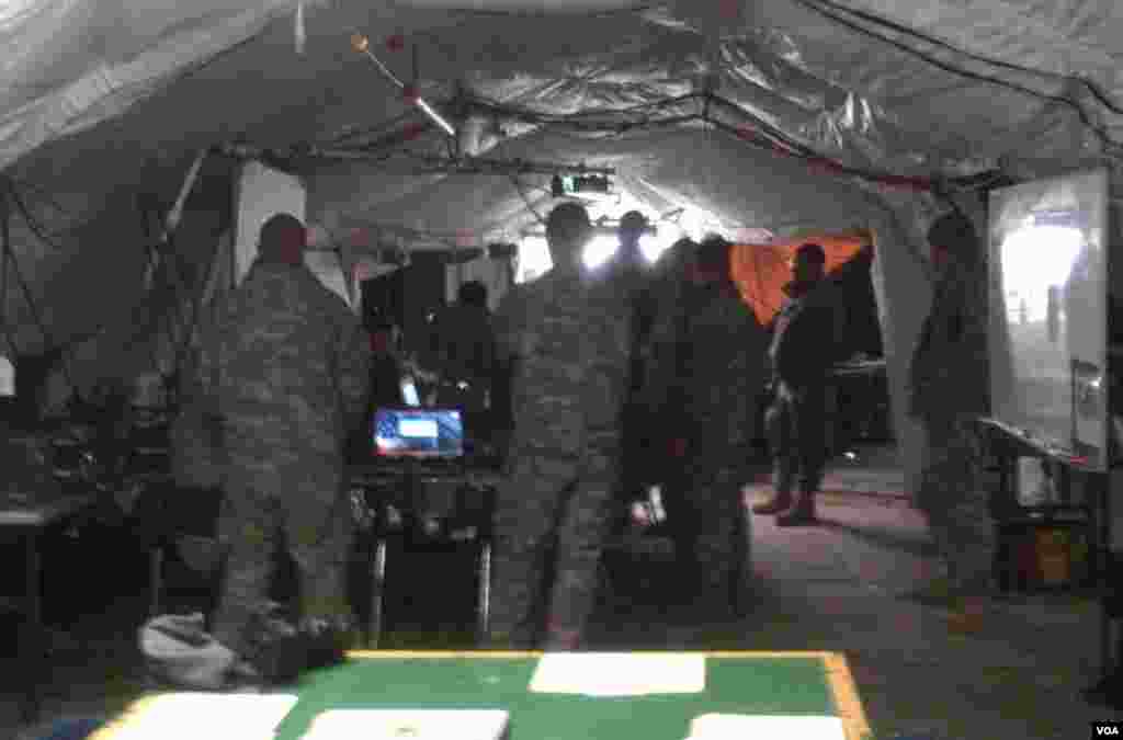 Soldiers in the Battalion Tactical Operations Center (TOC), where they are receiving situation reports from their tank companies, Pocheon, South Korea, January 25, 2013. (S. Herman/VOA) 