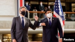 U.S. Secretary of State Antony Blinken, left, and Costa Rica's President Carlos Alvarado Quesada elbow bump each other after a news conference in San Jose, Costa Rica, June 1, 2021.