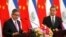 El Salvador's Foreign Minister Carlos Castaneda, left, speaks as China's Foreign Minister Wang Yi listens at a signing ceremony to mark the establishment of diplomatic relations between El Salvador and China at the Diaoyutai State Guesthouse in Beijing, China, Aug. 21, 2018.