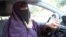 File - Kenza Drider, wearing a niqab, drives a car in Avignon, southern France.