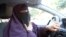 File - Kenza Drider, wearing a niqab, drives a car in Avignon, southern France.
