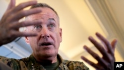 Joint Chiefs Chairman Gen. Joseph Dunford speaks to reporters aboard his plane, Aug. 12, 2017. 