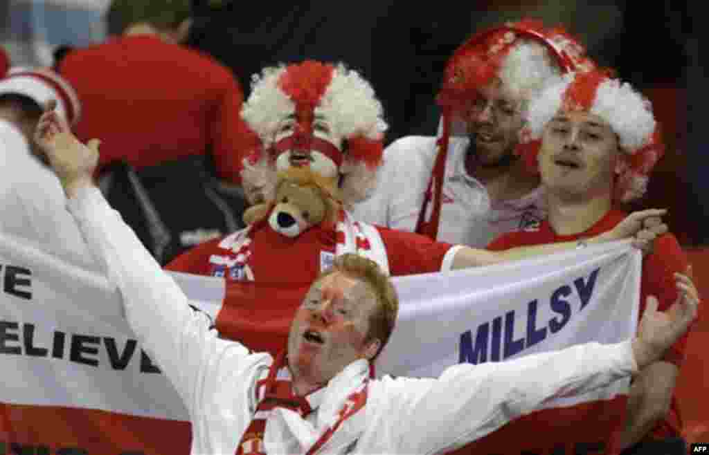 England fans celebrate winning the World Cup group C soccer match between Slovenia and England at Nelson Mandela Bay Stadium in Port Elizabeth, South Africa, Wednesday, June 23, 2010. England won 1-0 and advances to the round of 16. (AP Photo/Julie Jacobs