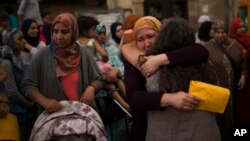 Members of the local Muslim community gather along with relatives of young men believed responsible for the attacks in Barcelona and Cambrils to denounce terrorism and show their grief in Ripoll, north of Barcelona, Spain, Aug. 20, 2017.