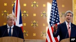Britain's Foreign Secretary Boris Johnson (L) listens as U.S. Secretary of State John Kerry speaks during a press conference at the Foreign Office in London, July 19, 2016.