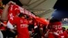 FILE - Hong Kong fans cover their faces and boo during the Chinese national anthem, at a friendly soccer match between Hong Kong and Bahrain in Hong Kong, Nov. 9, 2017.