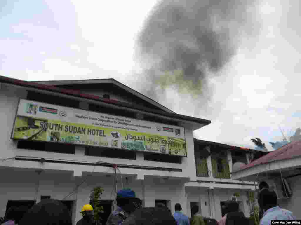 Smoke billows from the South Sudan Hotel in Juba and flames are visible under the roof after fire raked through the hotel on Wednesday, Oct. 2. 