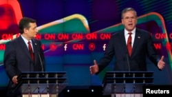 FILE - U.S. Senator Ted Cruz of Texas, left, and former Florida Governor Jeb Bush spar during the Republican presidential debate in Las Vegas, Nevada, Dec. 15, 2015.