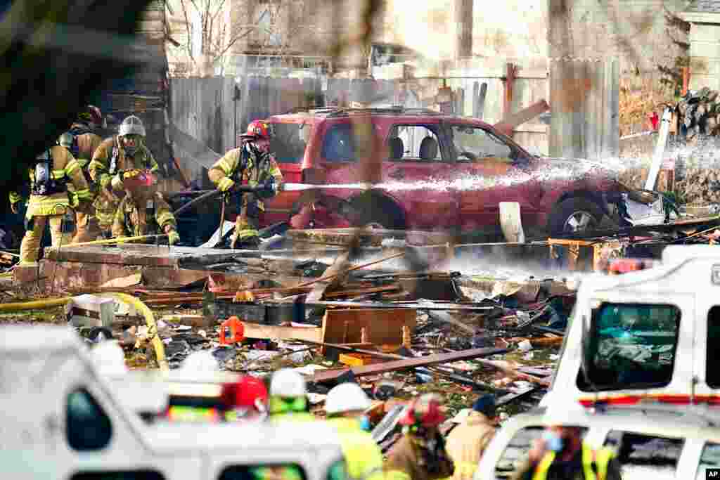 Firefighters work the scene of a deadly explosion that leveled a home in Omaha, Nebraska.