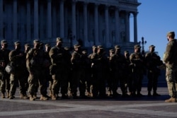 National Guard troops reinforce the security zone on Capitol Hill in Washington, Jan. 19, 2021, before President-elect Joe Biden is sworn in as the 46th president.