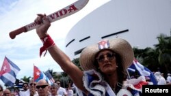 A woman shouts as she attends a rally ahead of an opposition demonstration in Cuba, in Miami, Florida, Nov. 14, 2021. 