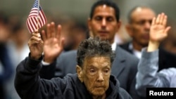 Ninety-seven-year-old Mercedes Rosa Ruiz Mejia from Nicaragua joins over 5,000 other immigrants taking the oath of citizenship during a naturalization ceremony in Los Angeles, California, April 16, 2013. 