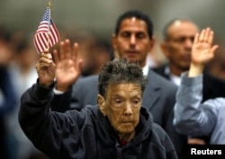 Mercedes Rosa Ruiz Mejia, 97, from Nicaragua takes the oath of citizenship in Los Angeles, California, April 16, 2013.