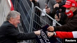 FILE - White House Chief of Staff Mark Meadows greets supporters of President Donald Trump during a campaign rally at Reading Regional Airport in Reading Penn., Oct. 31, 2020.
