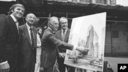 Governor Hugh Carey points to an artists' conception of the new New York Hyatt Hotel/Convention facility that will be build on the site of the former Commordore Hotel, June 28, 1978. At the launching ceremony are, from left: Donald Trump, son of the city developer Fred C. Trump; Mayor Ed Koch of New York; Carey; and Robert T. Dormer, executive vice president of the Urban Development Corp.