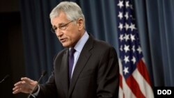 Secretary of Defense Chuck Hagel answers questions from the media during a press conference held in the Pentagon Press Briefing Room, March 31, 2014. 