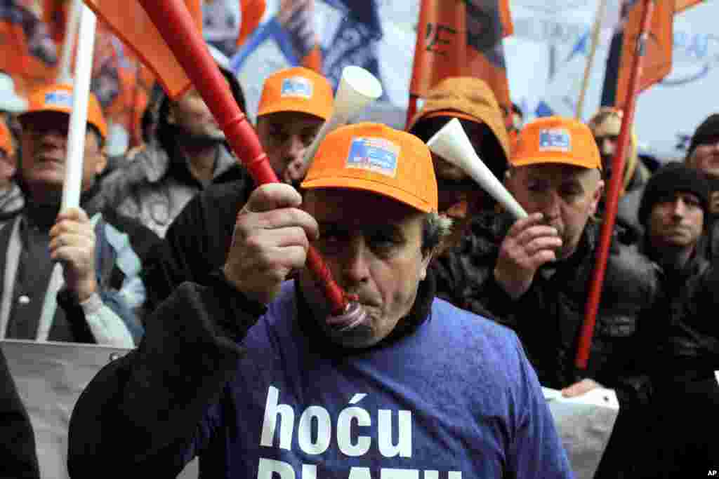 Members of a workers union sound off with horns during a protest in Belgrade, Serbia. Some 3,000 workers have rallied against a set of laws that government officials say are key to anti-crisis reform, but which could lead to further job losses in the impoverished Balkan country.