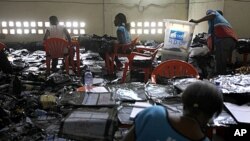 Election volunteers tabulate results at the Fikin compilation center in Kinshasa, Democratic Republic of Congo.