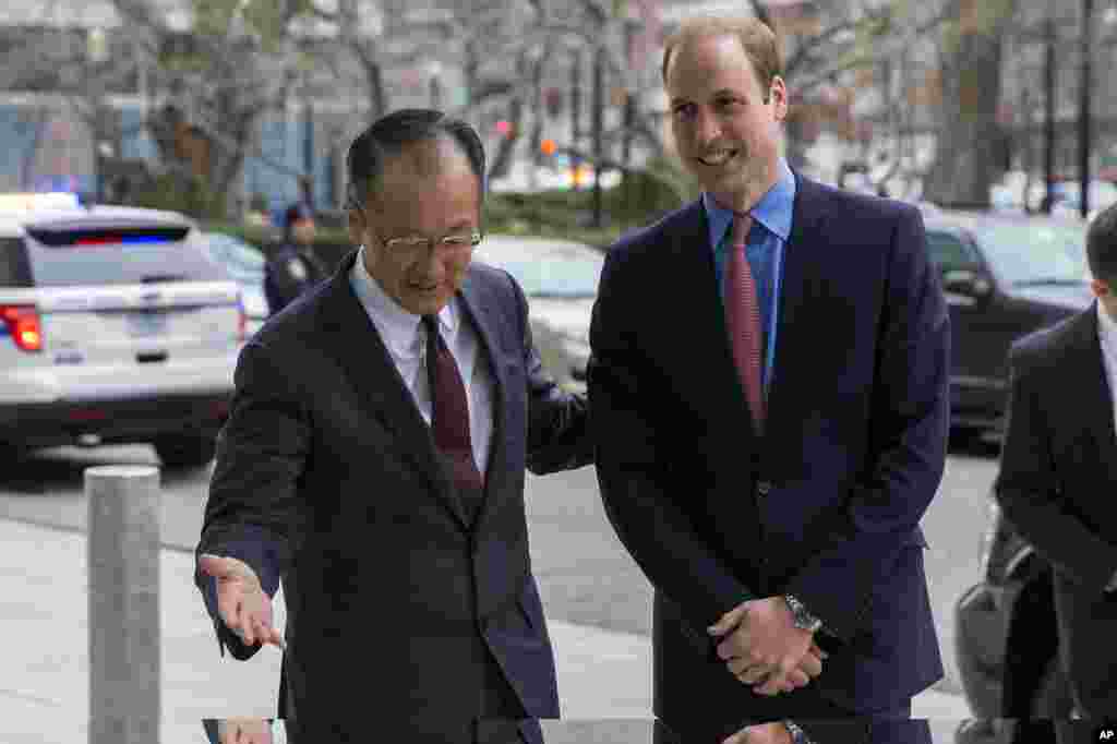 Prince William is greeted by World Bank President Jim Yong Kim before speaking on illegal transportation of wildlife parts across borders during an International Corruption Hunters Alliance event, at the World Bank in Washington, DC, Dec. 8, 2014.