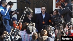 Russian opposition leader and anti-corruption blogger Alexei Navalny speaks to the media after a court hearing in Kirov, April 24, 2013.