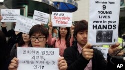 In this May 29, 2013 photo, South Korean protesters stage a rally urging China to stop repatriating North Korean defectors in front of the Foreign Ministry in Seoul, South Korea.