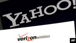 The Yahoo and Verizon logos on a laptop, in North Andover, Massachusetts, July 25, 2016.