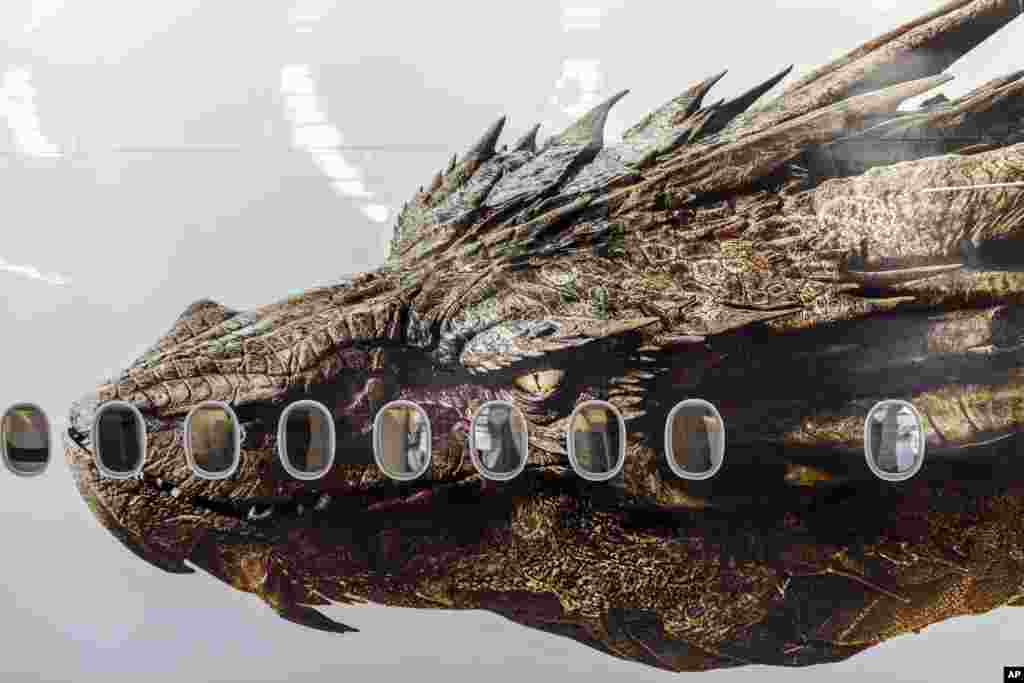 An image of the dragon Smaug from Peter Jackson&#39;s Hobbit trilogy is shown on the side of an Air New Zealand plane in Auckland, New Zealand. The image was unveiled to celebrate the premiere of &quot;The Hobbit: The Desolation of Smaug,&quot; which screens in Los Angeles, California, USA.