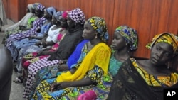 Some of the escaped kidnapped girls of the government secondary school Chibok, attend a meeting with Borno state governor, Kashim Shettima, in Maiduguri, Nigeria, June 2, 2014. 