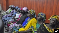 Some of the escaped kidnapped girls of the government secondary school Chibok, attend a meeting with Borno state governor, Kashim Shettima, in Maiduguri, Nigeria, June 2, 2014. 