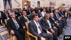 A picture provided by the Saudi Press Agency shows members of the Syrian opposition during their meeting in Riyadh, Dec. 10, 2015.