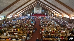 FILE - A mass in memory of Nelson Mandela takes place at the Regina Mundi church in Soweto, Johannesburg, South Africa, Dec. 2013.